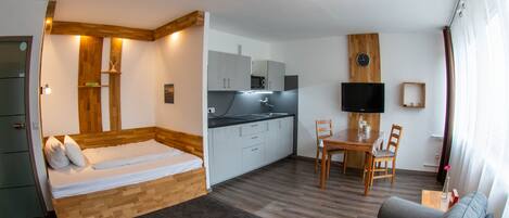 Comfort Studio | Living area | Flat-screen TV