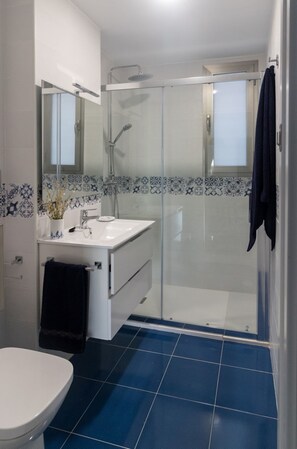 Shower, hair dryer, towels, soap