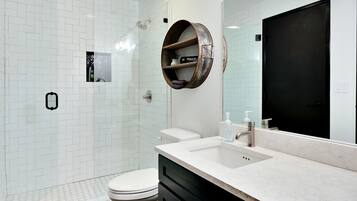 Shower, hair dryer, towels, soap