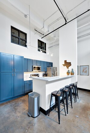 Fridge, microwave, oven, stovetop - Mesquite Hideaway- Downtown Luxury Loft w/ free parking (Waco)