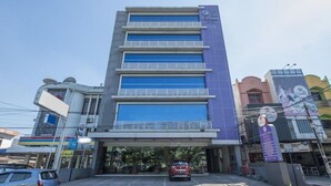 A multi-story hotel with a prominent 'Celino' sign on the facade. - All Nite and Day Makassar (Makassar)