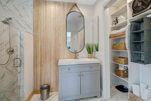 Bathtub, hair dryer, towels, soap