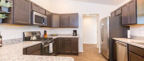 Fridge, cookware/dishes/utensils, dining tables