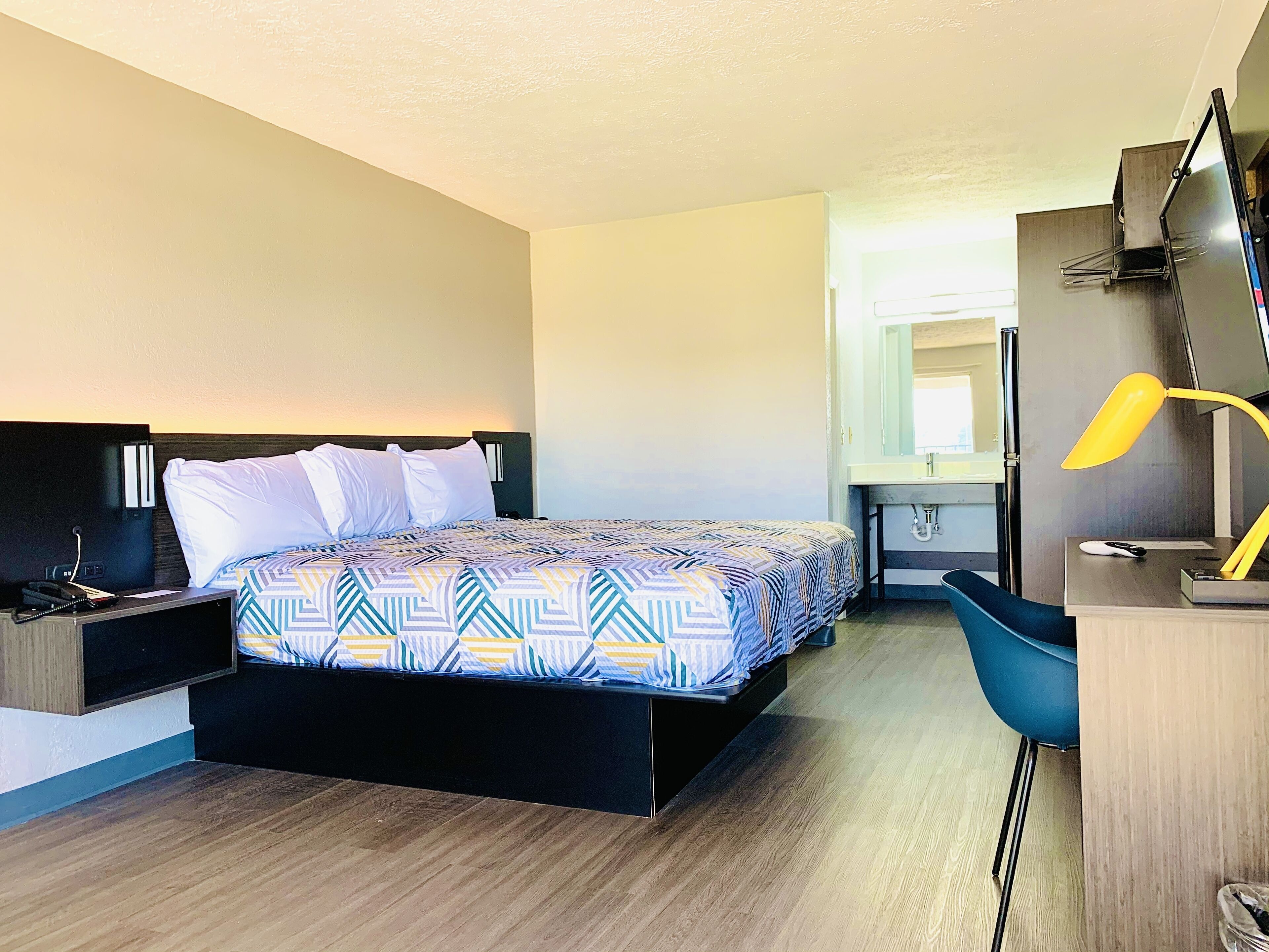 premium bedding, desk, laptop workspace, blackout curtains