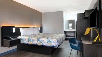 Premium bedding, desk, laptop workspace, blackout drapes