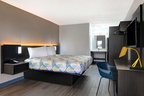 Premium bedding, desk, laptop workspace, blackout drapes