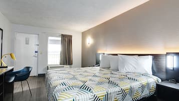 Premium bedding, desk, laptop workspace, blackout curtains