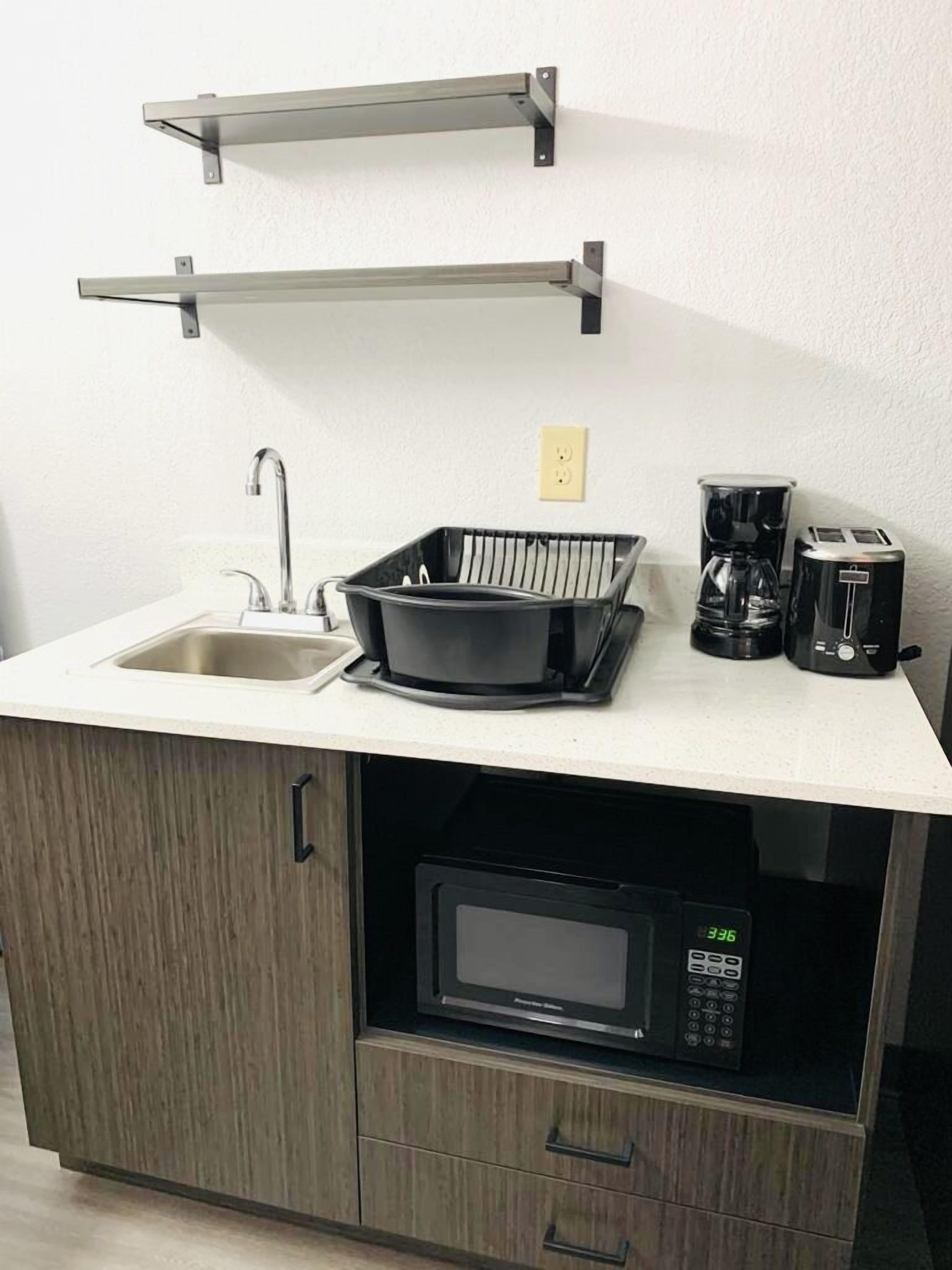 full-sized fridge, microwave, coffee/tea maker, toaster