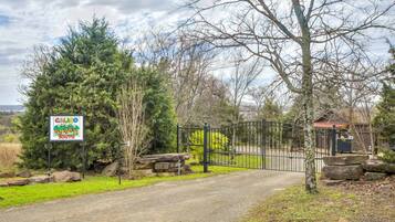 A gated entrance to a property with a sign indicating 'CALIGO THE HILLS SOUTH'.