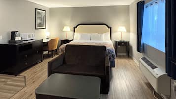 Suite, 1 King Bed, Non Smoking, Jetted Tub | Desk, laptop workspace, blackout drapes, iron/ironing board