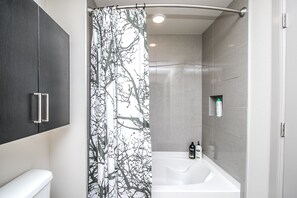 Luxury Condo | Bathroom | Combined shower/tub, free toiletries, hair dryer, bathrobes