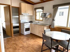 Economy 2 Bedroom Cabin | Private kitchen | Shared fridge, microwave, oven, stovetop