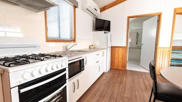 Standard Accessible 2 Bedroom Cabin | Private kitchen | Fridge, microwave, oven, stovetop
