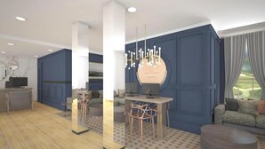 Una sala de estar moderna con una pared azul decorativa, una mesa de centro redonda y una araña.