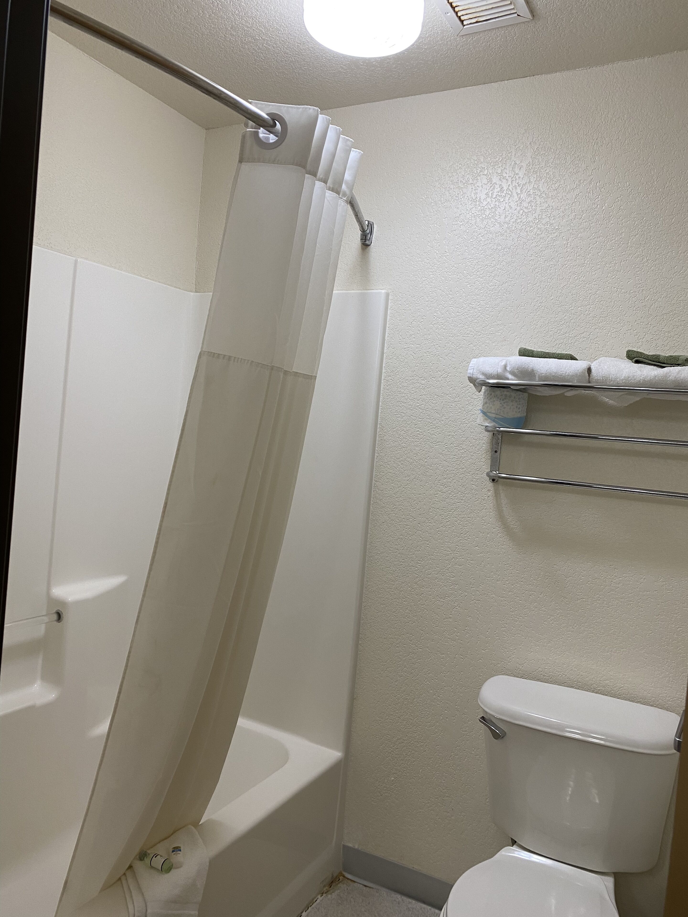 room, 2 queen beds | bathroom | hair dryer, towels, soap, shampoo