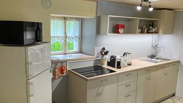 Fridge, microwave, stovetop, coffee/tea maker