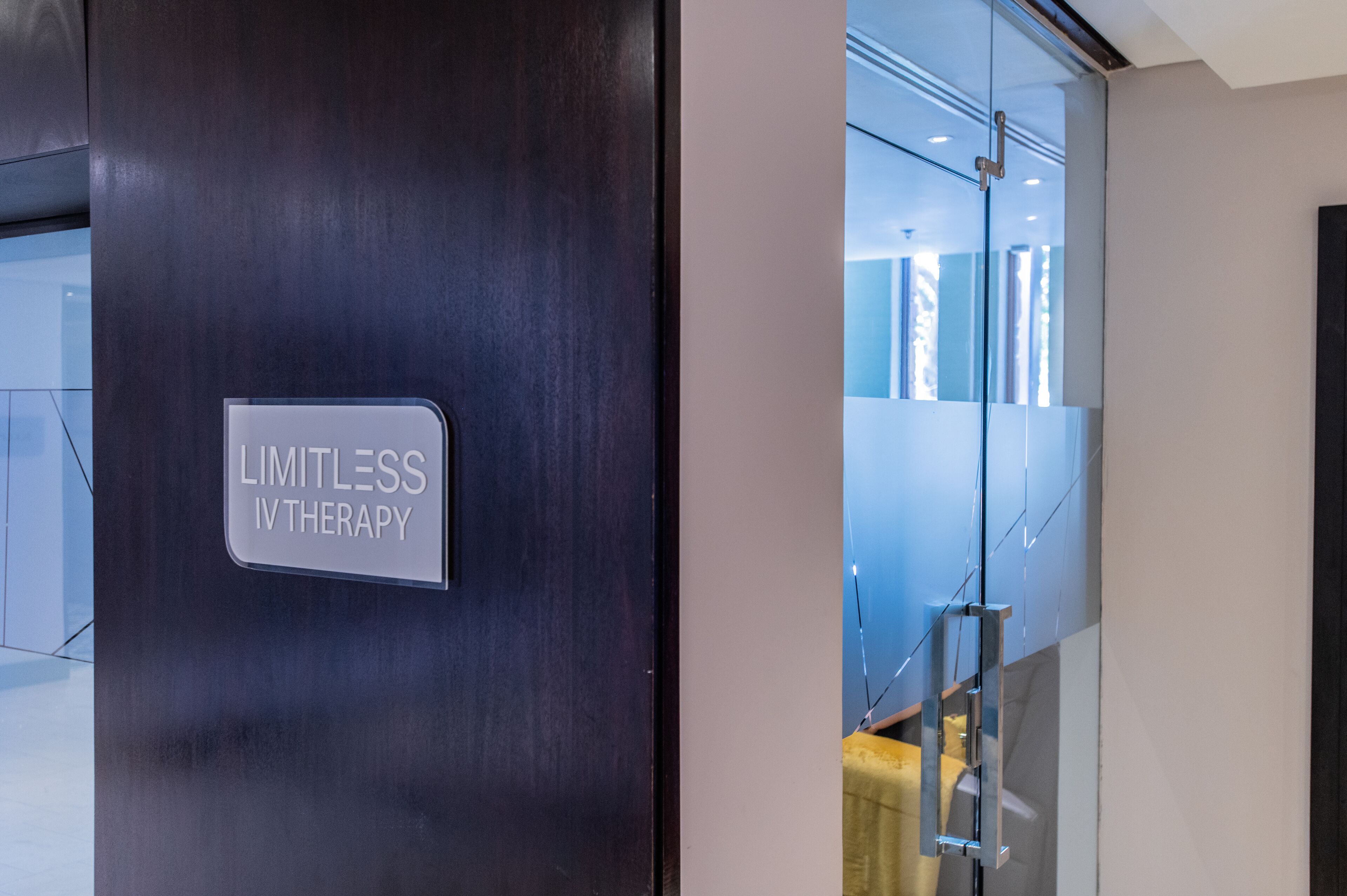 A modern interior with a sign reading "LIMITLESS IV THERAPY".