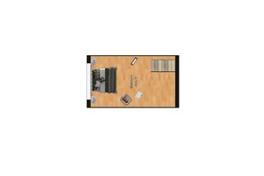 Ein Schlafzimmer mit Bett, Nachttisch, Kommode und Fenster.