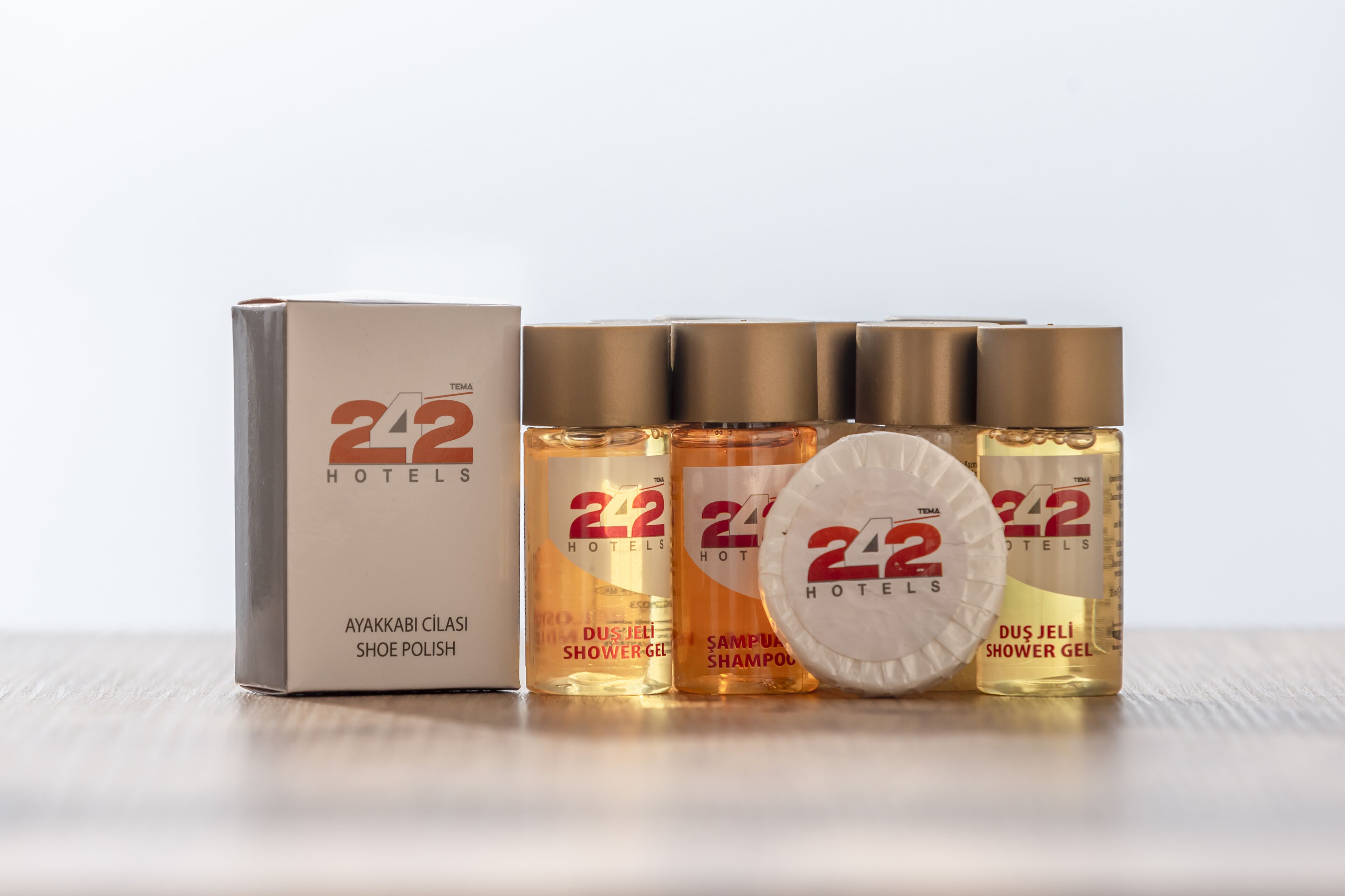 rainfall showerhead, hair dryer, slippers, towels