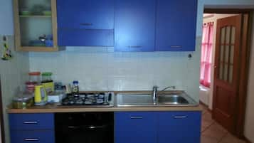 Fridge, cookware/dishes/utensils, dining tables