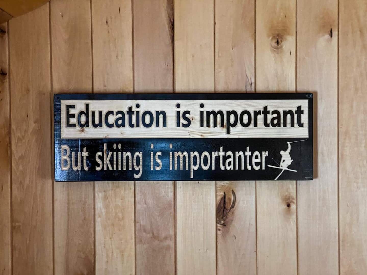 A wooden sign with text on a wall.