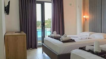 Triple Room, Sea View | Desk, iron/ironing board, free WiFi, bed sheets