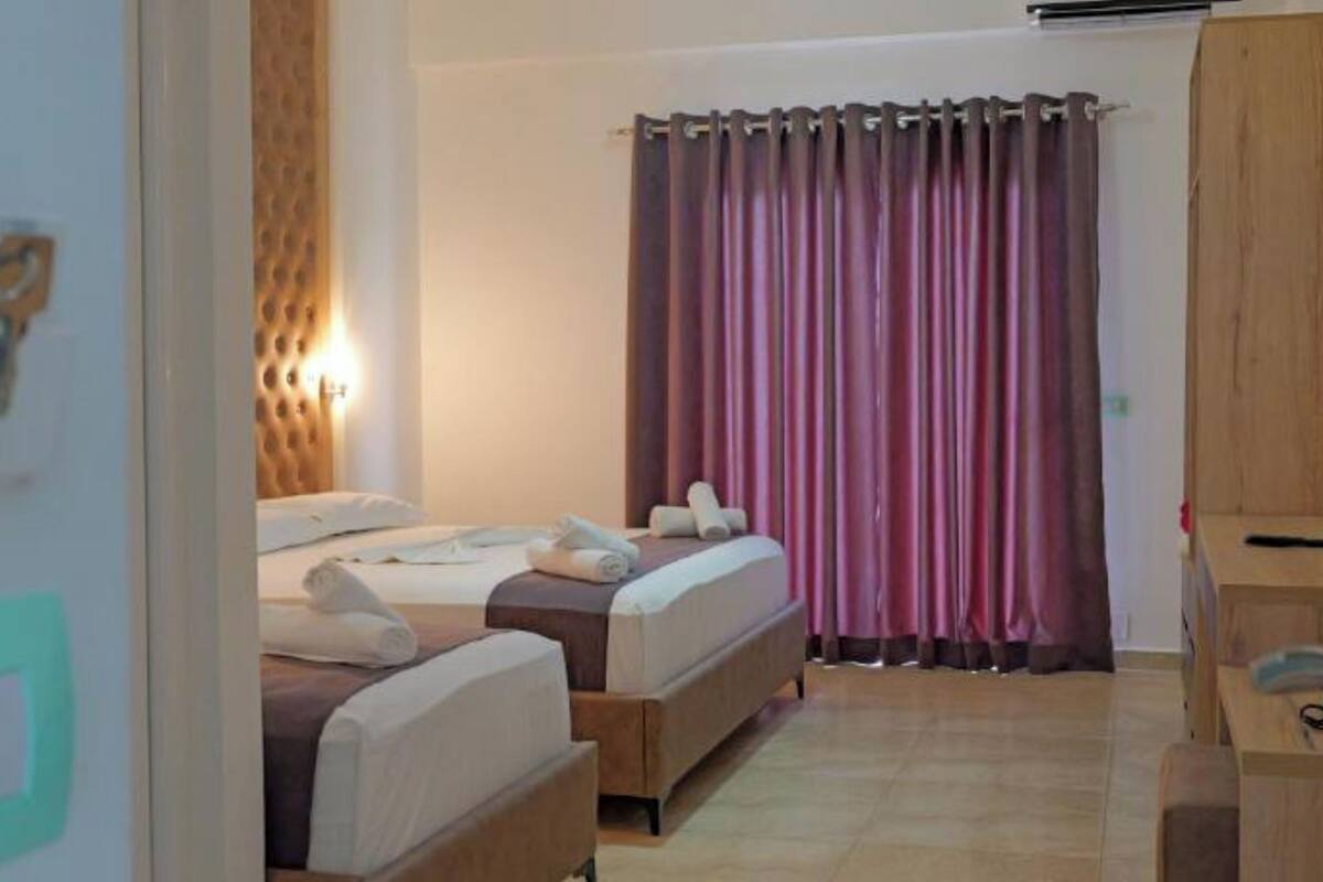 Triple Room, Garden View | Desk, iron/ironing board, free WiFi, bed sheets