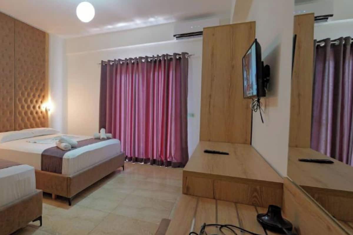 Triple Room, Garden View | Desk, iron/ironing board, free WiFi, bed sheets