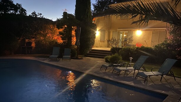 A swimming pool with lounge chairs and a patio area. - Superb villa in Puyvert Air conditioning, heated swimming pool, fully enclosed garden (Puyvert)