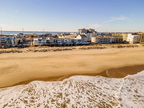 A coastal hotel with multiple buildings, a sandy beach, and a view of the sea. - Oceanfront 3 Bedroom 3 Bath Vacation Rental in Ocean City MD | Direct Beach Access, Sealax Awhile (Ocean City)