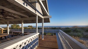 A wooden deck with benches and a covered area overlooking the beach. - Edisto 1BR w/Beach Access & Resort Amenities (Edisto Island)