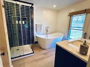 Combined shower/tub, hair dryer, bathrobes, towels