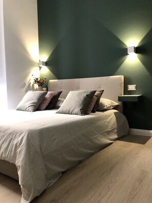 Cozy retreat with a central bed, light headboard, and plush pillows.