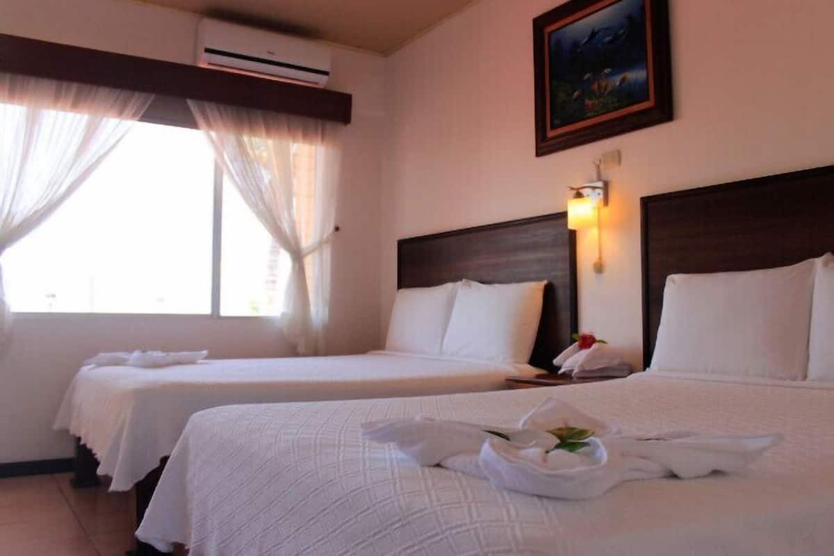 Economy Room, 2 Double Beds, Ocean View | Down duvets, desk, laptop workspace, blackout curtains