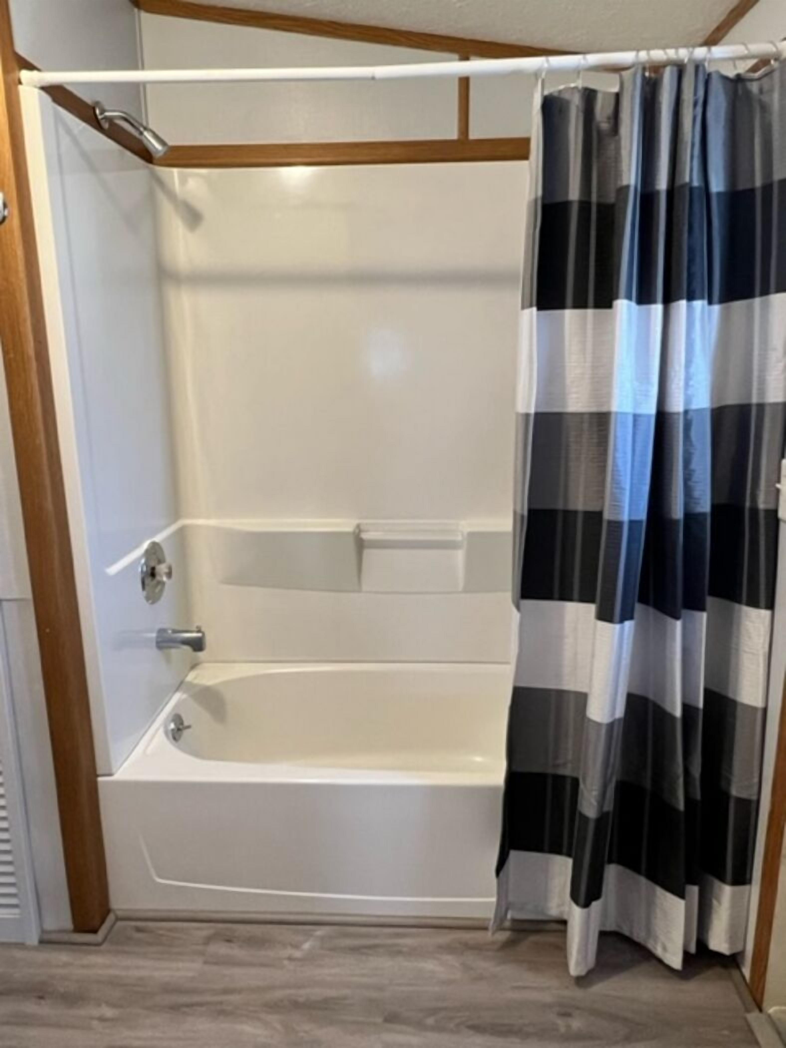 Combined shower/bathtub, hair dryer, towels, soap