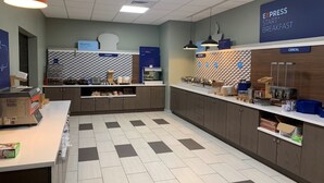 A modern breakfast area with a bakery section, a cereal display, and a coffee station. - Holiday Inn Express & Suites Canon City by IHG (Canon City)