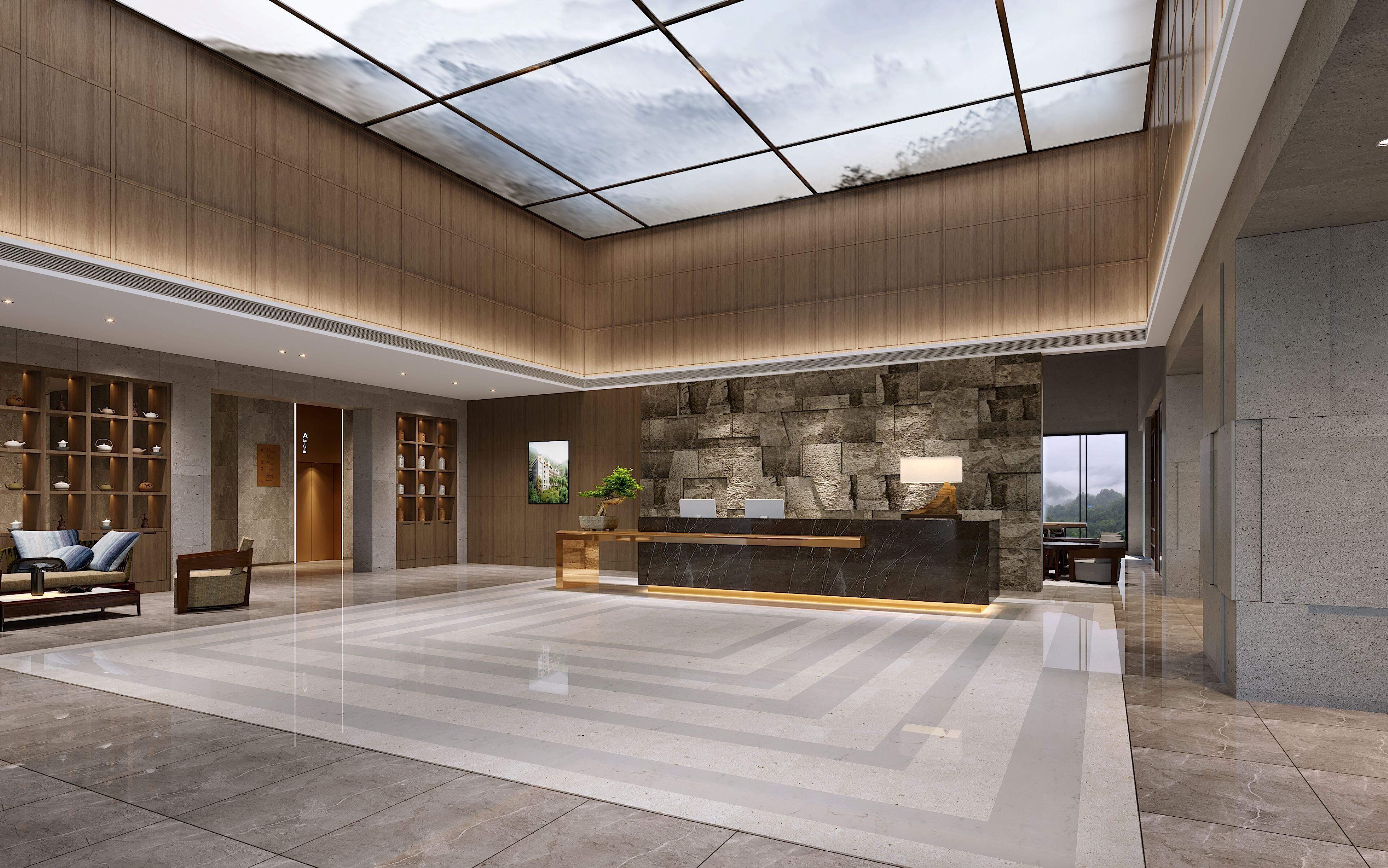 A spacious lobby with a high ceiling, a reception desk, seating area, and a stone wall.