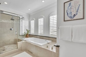 Combined shower/bathtub, hair dryer, towels, soap