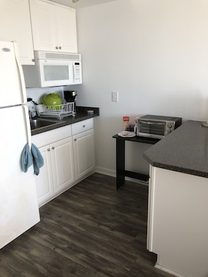 Fridge, microwave, coffee/tea maker, toaster
