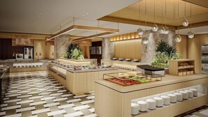 A modern hotel lobby with a central reception desk, seating areas, and a patterned floor. - Hotel Urashima (Nachikatsuura)