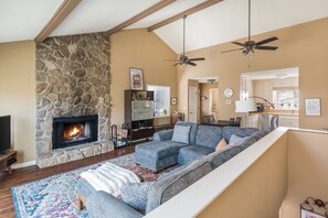 Smart TV, fireplace, books, offices