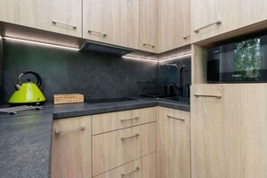 Fridge, microwave, stovetop, coffee/tea maker