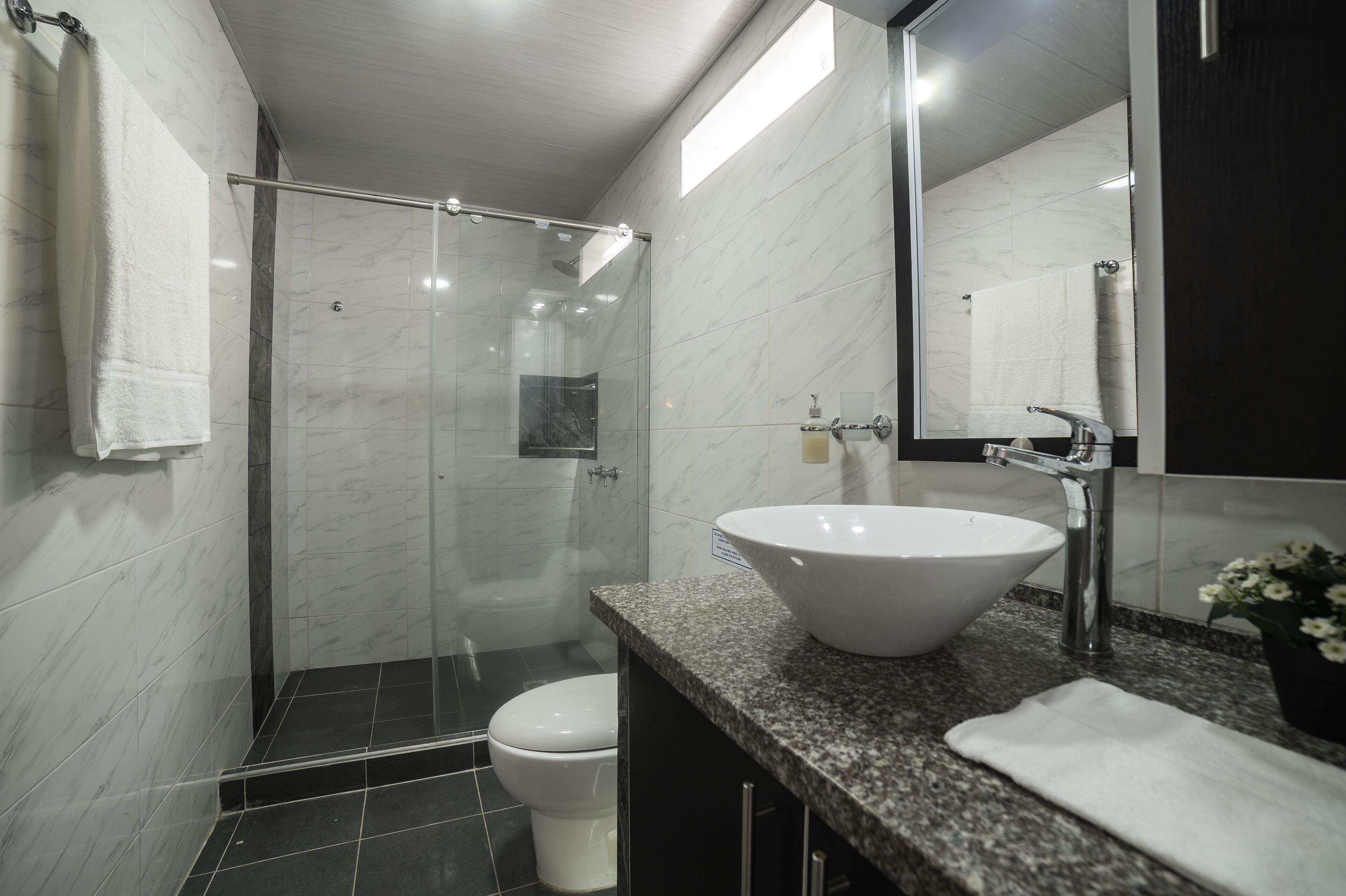 Shower, towels, soap, shampoo