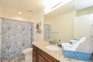 Combined shower/bathtub, hair dryer, towels, soap