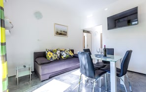 Apartamento | Sala de estar | TV