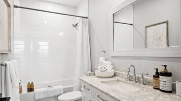 Combined shower/tub, hair dryer, towels, soap