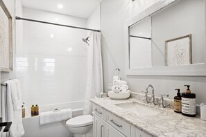 Combined shower/bathtub, hair dryer, towels, soap