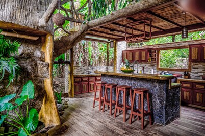 Secluded Treetop Home w/solar panels, Private Balcony, steps from the beach