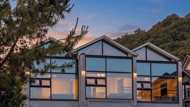 A modern building with large windows and a mountain backdrop. - Gapyeong Shiny Pension (Gapyeong)