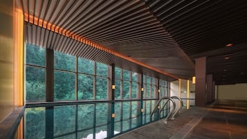Indoor pool, outdoor pool, pool umbrellas, lifeguards on site